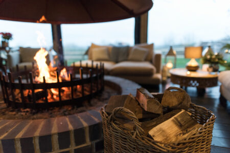 An image of a fireplace at the Treehouse Clubhouse at Port Lympne Hotel and Reserve