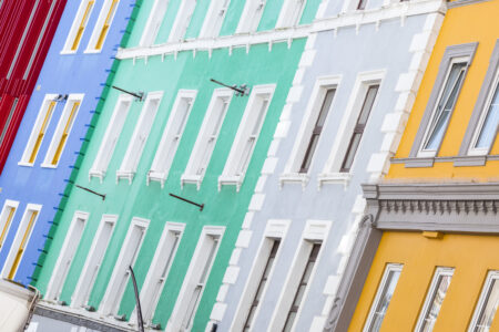 A series of colourful buildings next to each other with traditional features